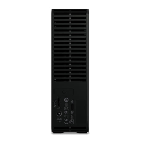 Rückansicht einer Western Digital WD Elements Desktop 8 TB - Externe Festplatte (USB 3.0) mit Lüftungsschlitzen, Einschaltknopf, USB 3.0-Anschluss, Netzeingang und Zertifizierungsetiketten an der Unterseite.
