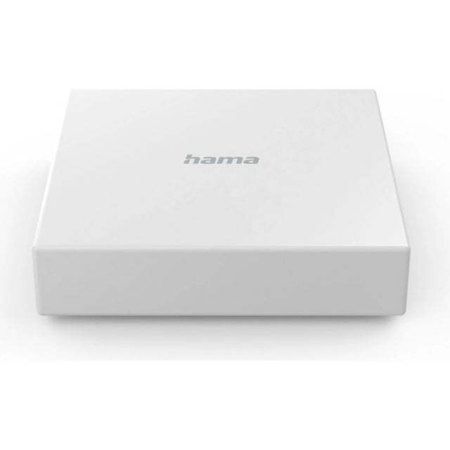 Der Hama Smart-Home-Hub, ein rechteckiges weißes Gerät mit dem Markennamen Hama in Grau auf der Oberseite, ist für intelligente Häuser konzipiert und unterstützt das Zigbee-Protokoll. Er ist vor einem schlichten weißen Hintergrund abgebildet.